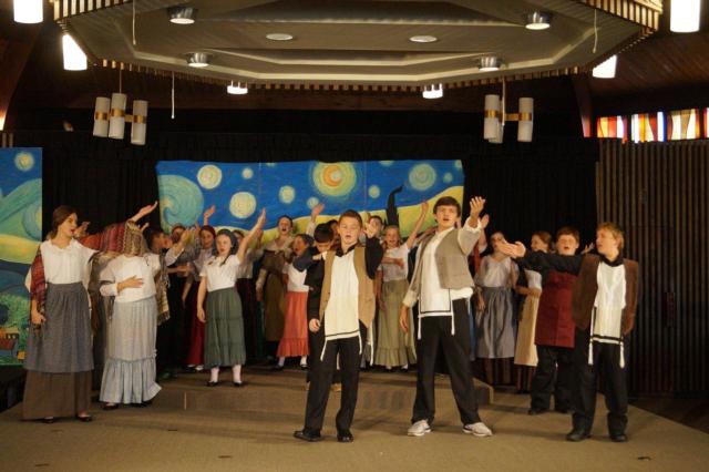 St. Mary’s Students singing “Tradition!