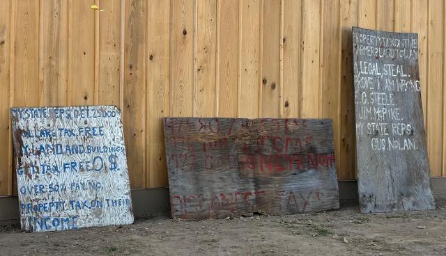 Signs hung by Nolan.
