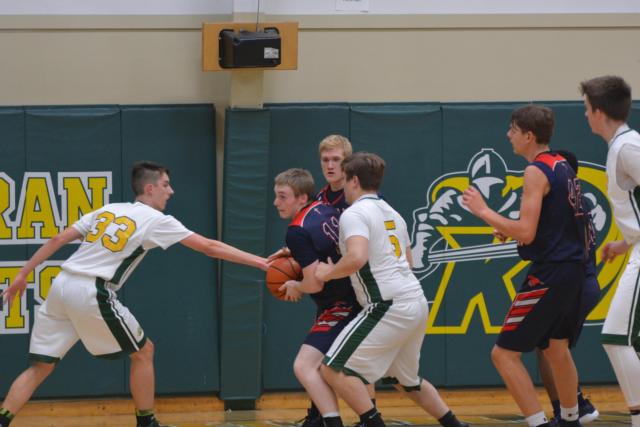 Cooper Krone stretches out defending against Centralia Our Christ Lutheran. (Photo by Dan Brannan)