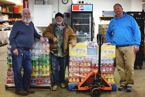 Les Hahn, George Colahan, and Steve Whitehead are all volunteers with the Community Hope Center in Cottage Hills. They were more than happy to receive one of the five donations of food from the SEF Food Drive on Friday.