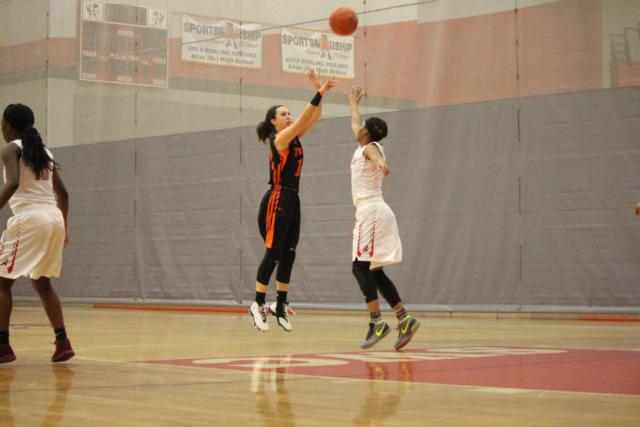 Edwardsville's Makenzie Silvey launches a shot against Alton. (Photo by Madelaine Gerard)