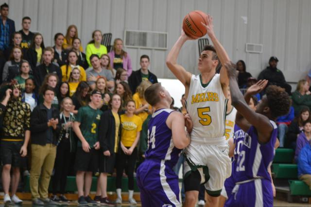 JJ Schwartz goes up for a shot for Metro East Lutheran on Monday night. (Photo by Dan Brannan)