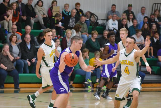 The Knights' Zach Miller defends against Litchfield on Monday. (Photo by Dan Brannan)