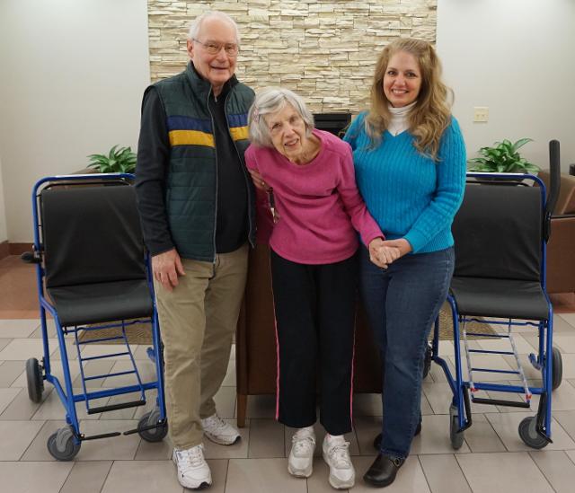 Art and Jo Greenwood and their daughter, Holly Rain, with the two Staxi wheelchairs purchased by the family.