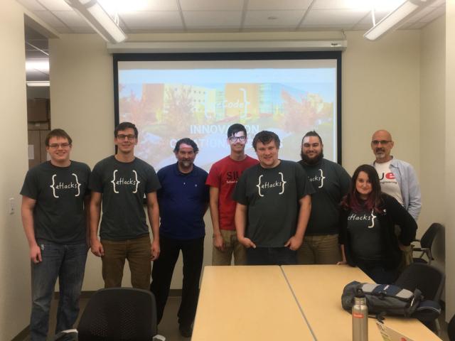 (L-R) weCode team, including sophomore Zach Anderson, senior Gabe Maurer, Dr. Dennis Bouvier, chair of the Department of Computer Science, seniors Tivon Missi, Jacob Baird, Morgan Zellers and Meg Heisler, and Socratis Tornaritis, professor of computer science.