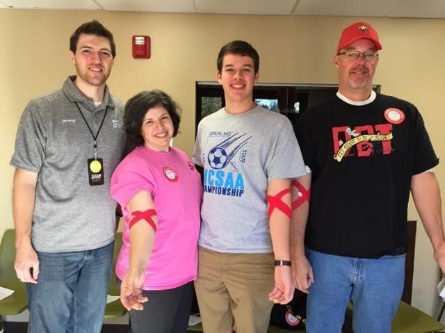 Mike and Diana Hopkins with two of their six children donate blood every year.