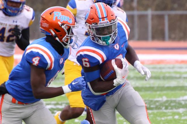 Running back TaRyan Martin runs with the ball against Crete Monee in the quarterfinals.