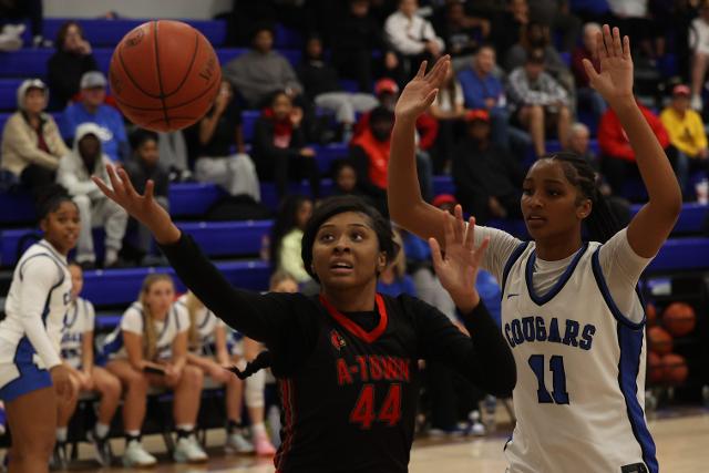 Alton’s Jarius Powers goes up for a shot against Lutheran St. Charles Kennedy Stowers on Saturday night. (Photos by Brad Piros)
