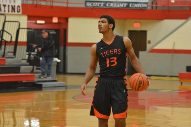 Mark Smith handles the ball for the Tigers on Friday in the tourney at Highland. (Photo by Dan Brannan)