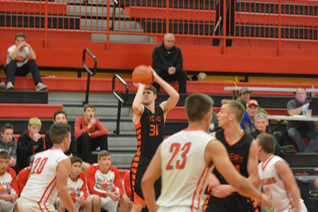 Oliver Stephen launches a three-pointer in Edwardsville's game against host Highland in tourney action Friday night. (Photo by Dan Brannan)