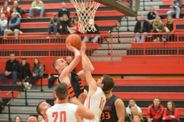 Caleb Strohmeier slides to the basket on Friday night. (Photo by Dan Brannan)