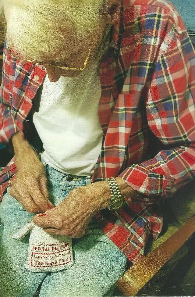 Kimberly Brown's father, David Warren, packing a care package for troops stationed in Korea in 2015. Warren served in the Marines during the Korean War. 