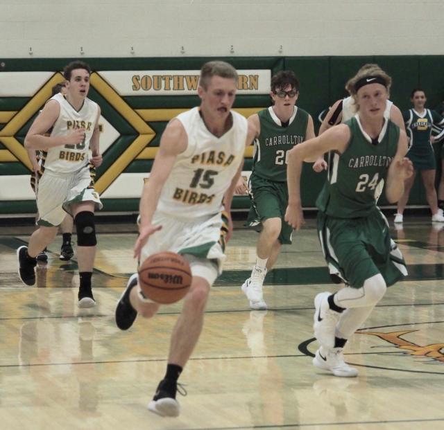 Caden Heyen (15) on a fast break is chased by Hunter Flowers (24).