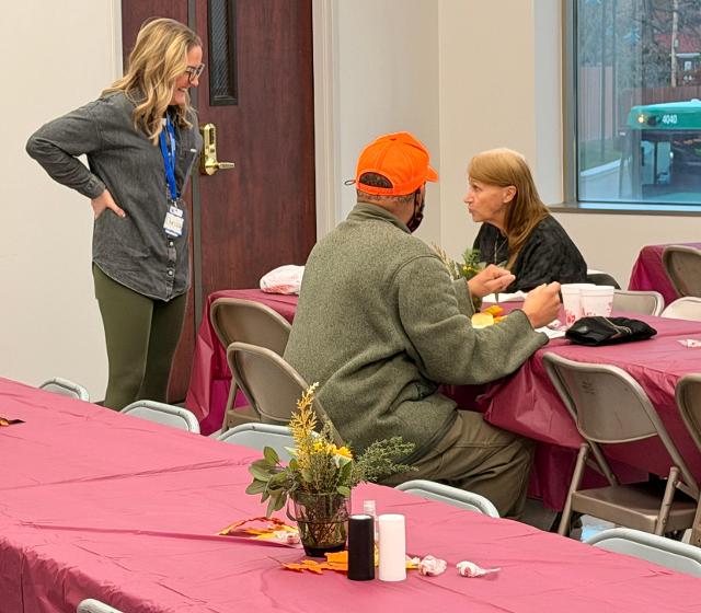 County Board member Chrissy Wiley of Bethalto spoke to several of the homeless who attended the dinner, sharing kindness and laughter.