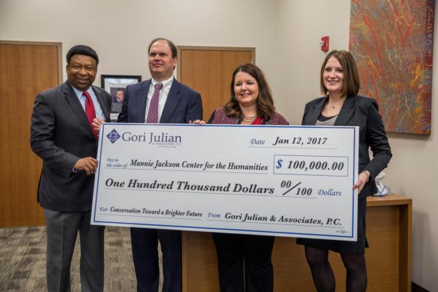 Dr. Ed Hightower, left, stands with Randy Gori in accepting a $100,000 check to the Mannie Jackson Center for the Humanities. (Photos by Charles Thomas)