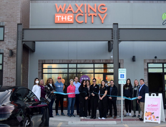 Waxing the City's ribbon-cutting ceremony.