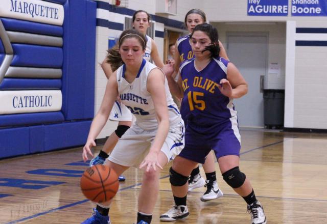 Caitlyn Hanlon makes a move passed Caitlyn Fields. 