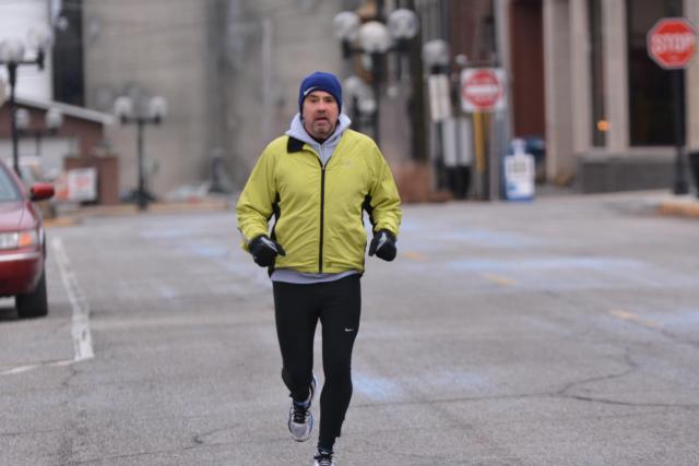 Some, like this jogger, have not let ice and rain cause them to stay away from their daily exercise routines. (Photo by Dan Brannan)