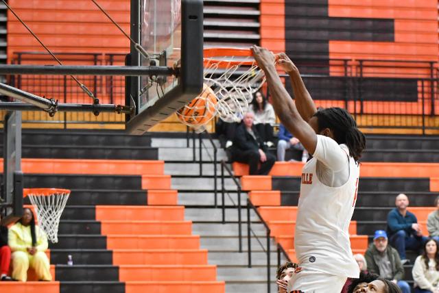 Devyon Hill-Lomax was outstanding again Tuesday night against Gateway STEM. He is shown here on a first quarter slam dunk. He had 13 points in the contest to help guide the Tigers to the win. These three photos show his progression in the energetic dunk. (Photos by Dan Brannan).