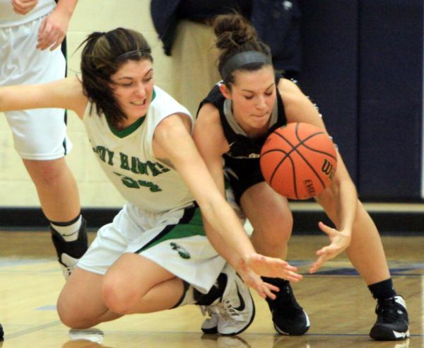 Carrollton's Rachel Williams scampers for a loose ball against West Central in the North Greene Tourney on Thursday night.
