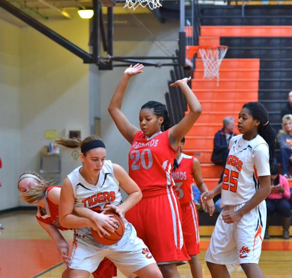 Edwardsville's Rachel Pranger pulls to the basket as Alton's Jewel Wagner defends in Thursday night's game at Edwardsville.