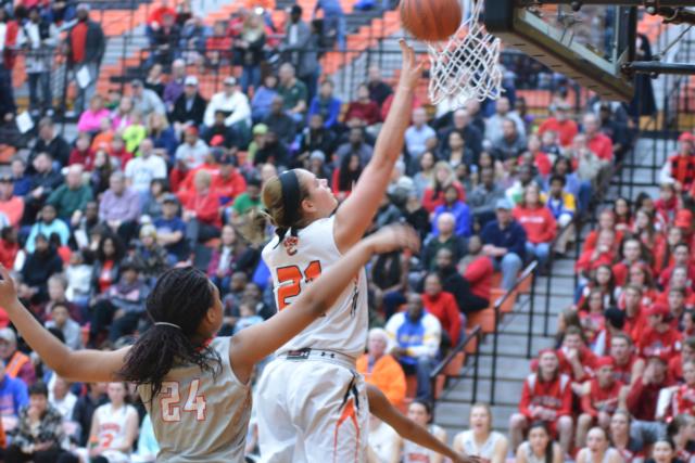 Rachel Pranger goes in for a layup against Alton on Friday night. Pranger had 16 points in the contest. (Photo by Dan Brannan)