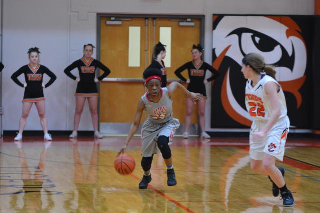 Edwardsville's Kate Martin defends against an Alton foe. (Photo by Dan Brannan)