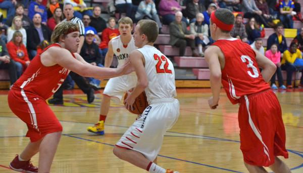 Zach Golenor slides in for two points in the Roxana-Staunton contest.