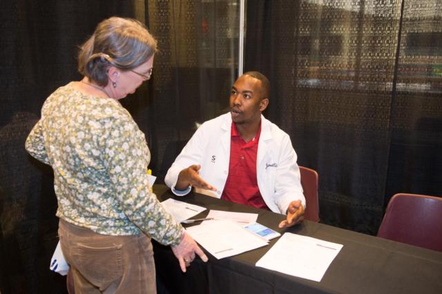 School of Pharmacy student Jamal Sims visits with Cheryl from Highland at SIUE’s 11th annual Free Diabetes Education Program.