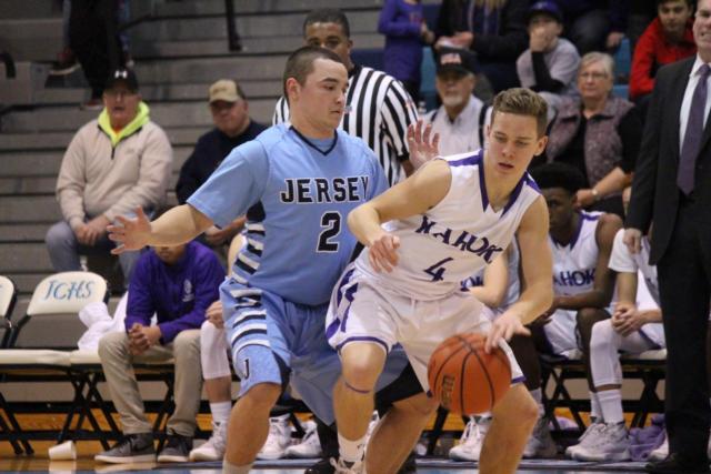 Jacob Witt blocks Tommy Madden from gaining ground to the basket. 