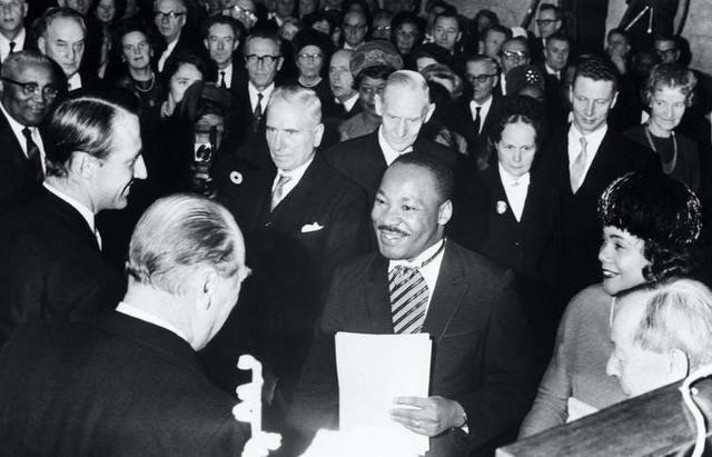 Crown Prince Harald and King Olav of Norway congratulate King after he receives the Nobel Peace Prize in Oslo in 1964. Bettmann