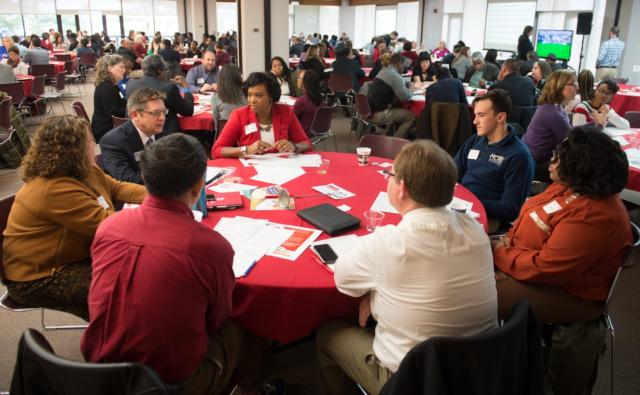 Attendees at the Diversity Strategic Plan Summit discuss objectives and outcomes in small groups.