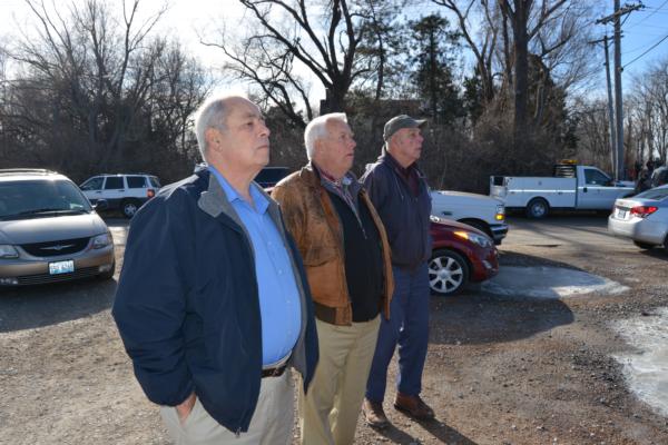 Glen Reichman of Hamel (middle) and friends observe the demolition of a portion of the Old Chain of Rocks Canal Bridge on Tuesday. Reichman is the owner of nearby Reichman Trucking.