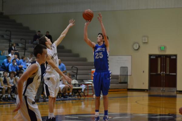Marquette's Max Goepel launches a three-pointer in the Jersey Tourney on Monday.