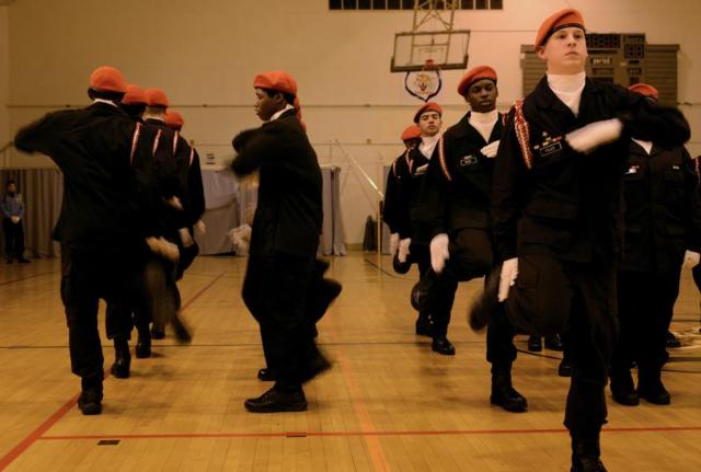 Cadets with the Lincoln's Challenge Academy Drill Team perform at LCA's annual Thanksgiving Program Nov. 24, 2015. LCA is a program for at-risk youths in Illinois that teaches cadets self-worth, discipline and job skills through a quasi-military, six-month program designed to get them back on track. (U.S. Army photo by Staff Sgt. Bryan Spreitzer, Illinois National Guard Public Affairs)