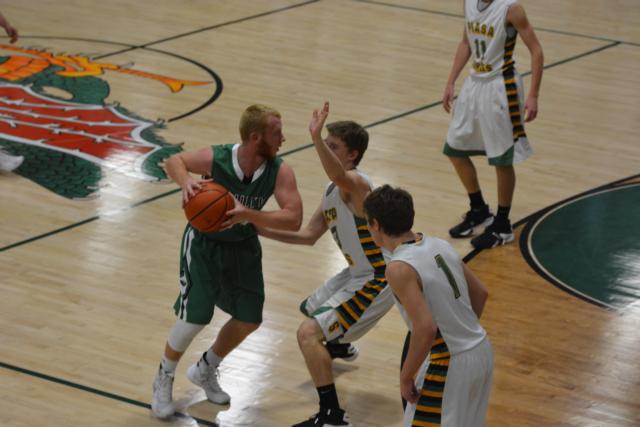 Cole Brannan eyes the inside of the lane near the three-point line in Tuesday's game against Southwestern. The Carrollton star finished with nine points. (Photo by Dan Brannan)
