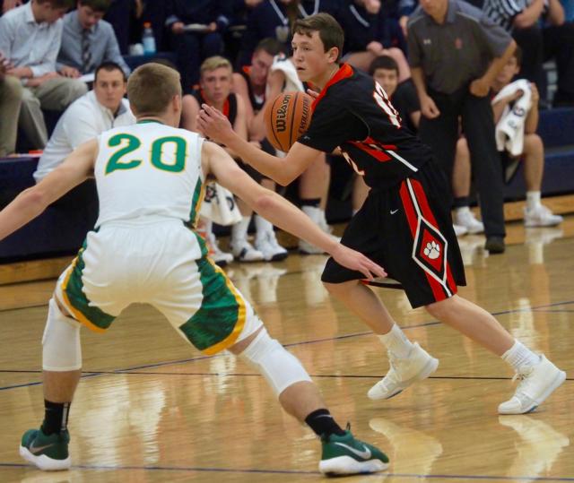 Ben Nord (12) being guarded by fellow sophomore Nathan Hendricker.