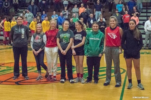 The Carrollton St. John's seventh-grade girls team was recognized at the recent Carrollton varsity girls contest for their achievements. The girls play for the state championship on Thursday at Assumption. (Photo courtesy of Michael Weaver)