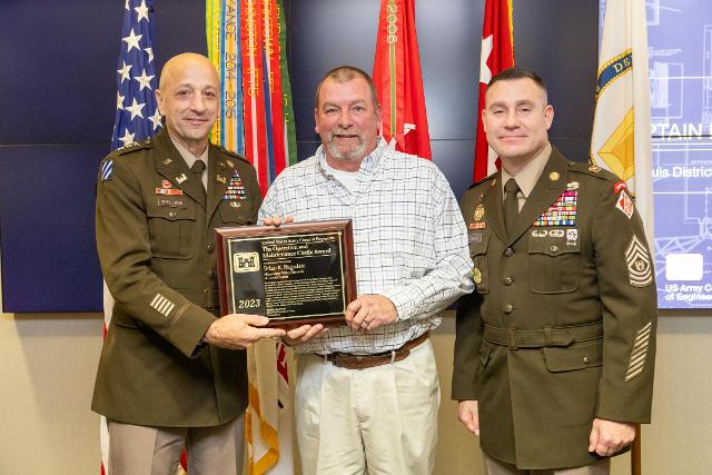  U.S. Army Corps of Engineers Chief of Engineers and Commanding General Lt. Gen Scott Spellmon presents Brian Ragsdale, St. Louis District Dredge Potter master with the 2023 Chief of Engineers Operations and Maintenance Castle Award during the 2023 National Awards Ceremony at the Corps of Engineers headquarters in Washington, D.C., Nov. 29, 2023.