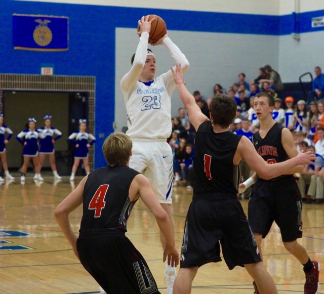 Jonah Hopper shoots mid-range jump shot over Trey Hart (1) and Chandler Sievers (4).