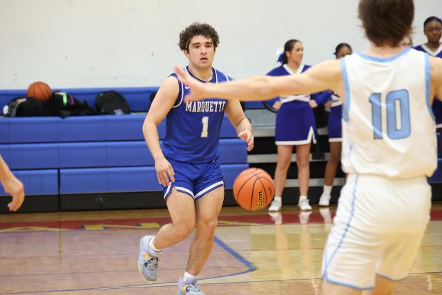 Senior guard Parker Macias looks to set-up a play against Jersey in the Roxana Hoopsgiving Classic earlier this season. (Photo credit: Bradley Piros)