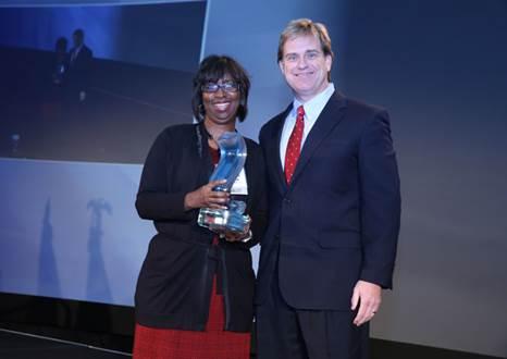 Challenge Unlimited&rsquo;s Executive Officer of Business and Finance Charlotte Hammond and STL Communications President & CEO Steve Leidholdt.