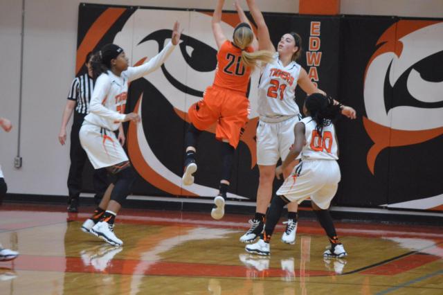 The Tigers' Rachel Pranger goes up in the air to defend against Normal on Saturday afternoon. Pranger paced the Tigers with 23 points against Normal. (Photo by Brent Feeney)