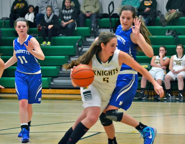 Karley Schley drives for two points against Marquette on Tuesday night at Metro-East Lutheran.