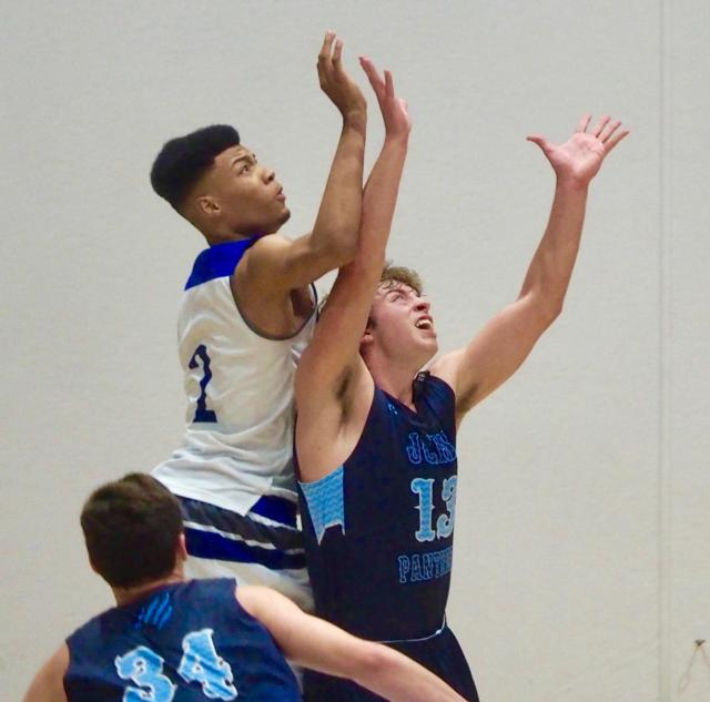 Lucas Ross (13) and Richard Robinson go up for a rebound.