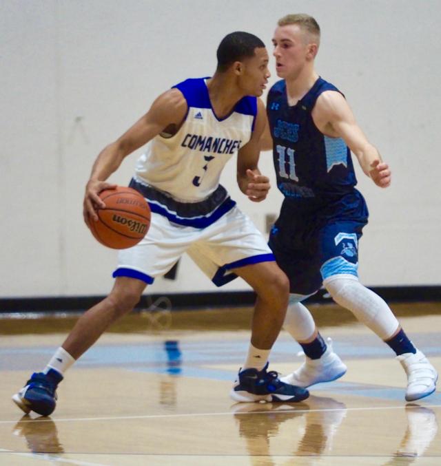Brett Tuttle (11) guards Elijah Rice (3).