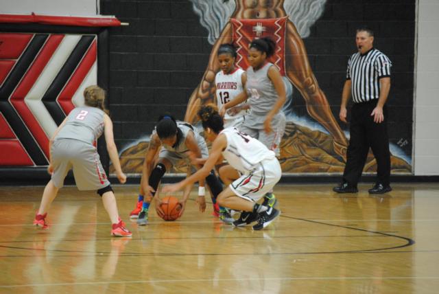 Alton and Granite City girls scramble for the ball Thursday night.