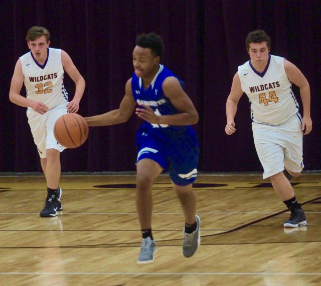Isaiah Erving dribbles in the back-court.