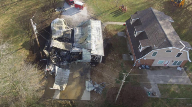 The home on the right was preserved today by area firefighters' quick response. To the left is the remnants of the oversized garage destroyed by fire.