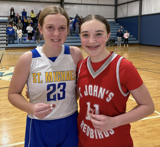 Outstanding Sportsmanship Pin Winners from the IESA Sevneth-Grade Girls Tournament: #23 Ava Hoene from Sigel St. Michael and #11 Brooklyn Steinacher from Carrollton St. John.
